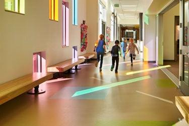 Students in walk down a school hallway